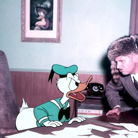 Voice actor Clarence Nash talking to animated character Donald Duck