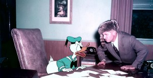 Voice actor Clarence Nash talking to animated character Donald Duck