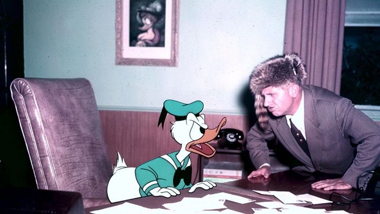 Voice actor Clarence Nash talking to animated character Donald Duck