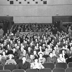 People sitting in the Disney Studios theater.