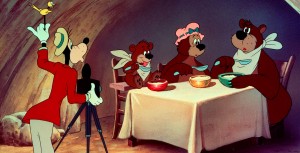 Goofy measuring a bear in Disney film "Hold that Pose"