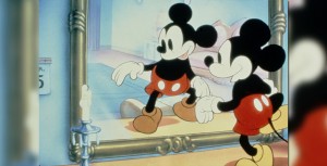 Mickey standing in front of a mirror