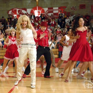 still from movie High School Musical showing kids doing a dance routine on gymnasium floor