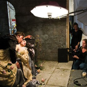 photo of Zac Efron and Vanessa Hudgens lying together being photographed by Annie Leibovitz