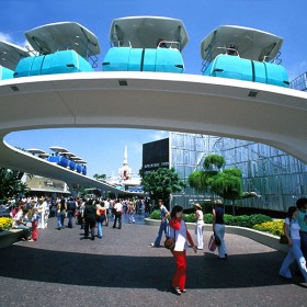photo of row of PeopleMover cars on curving overhead track at Disneyland