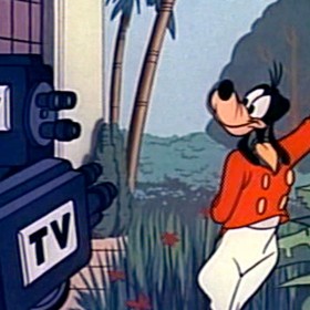 Scene of Goofy posing for the cameras in Goofy's Success Story