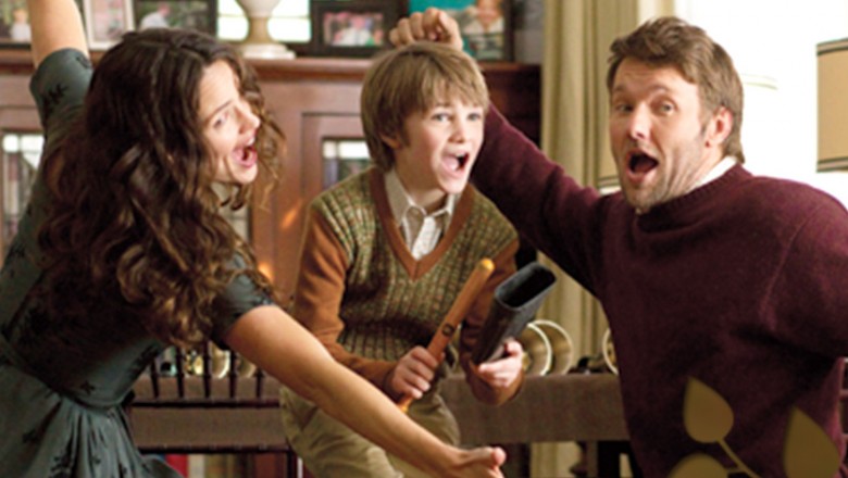 still from movie The Odd Life of Timothy Green showing family singing together