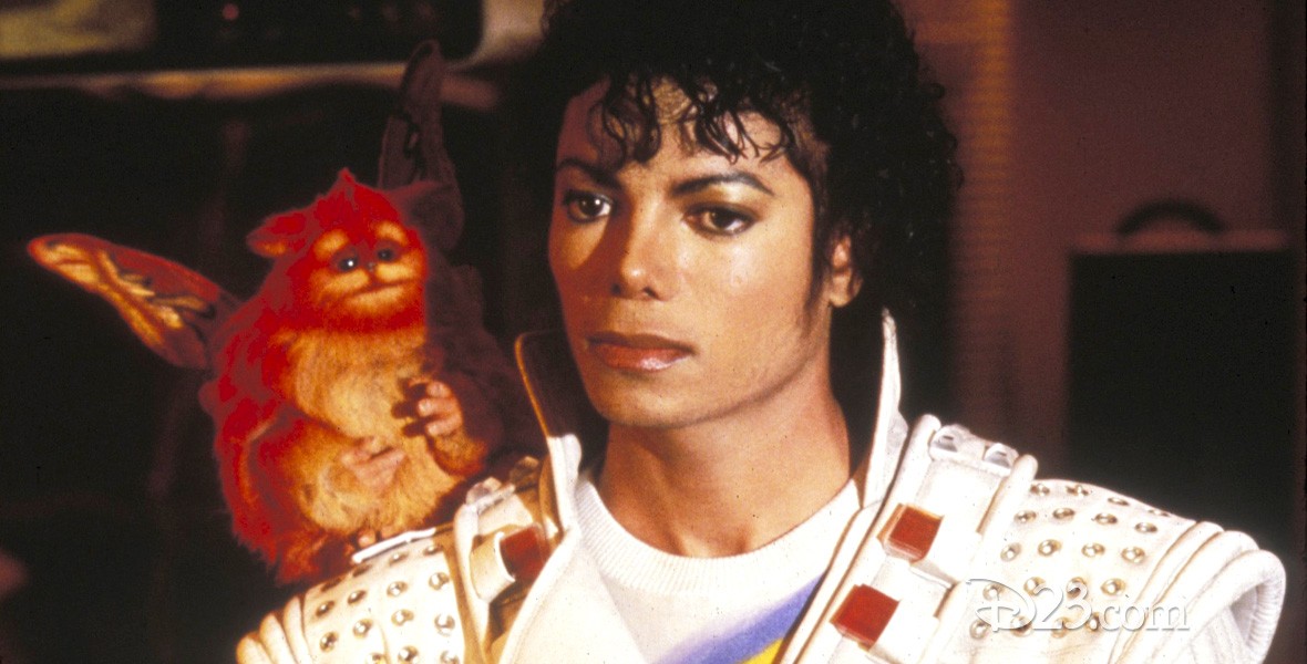 photo of Michael Jackson in costume as Captain EO with small pet monkey on one shoulder