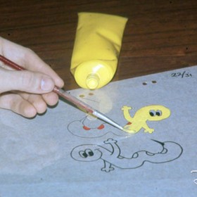 photo of animation cel being hand painted