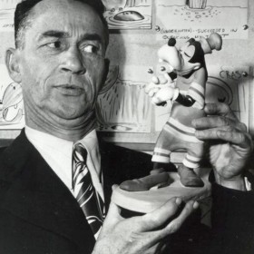 photo of Pinto Colvig holding a Goofy figurine