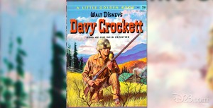 illustrated book cover Davy Crockett, King of the Wild Frontier, crouching in his leather jacket and coonskin cap holding his rifle