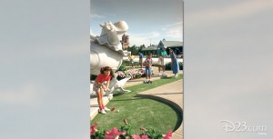 photo of family of four on putt-putt greens of Fantasia Gardens Miniature Golf and Garden Pavilion