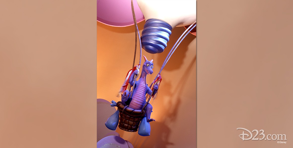 photo of Figment, a purple dragon figurine riding in a hot-air balloon basket