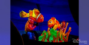 stage production photo of brightly costumed characters in Finding Nemo—the Musical