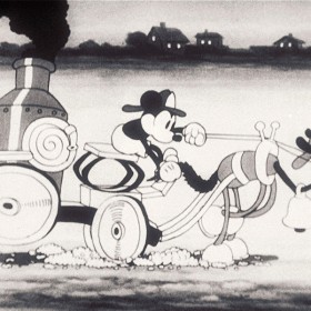 cel from black-and-white Mickey Mouse cartoon, The Fire Fighters showing Mickey driving a one-dog fire engine in a big hurry