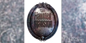 photo of oval metal sign for Haunted Mansion