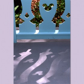 photo of section of fence showing routed out pattern in the shape of Mickey Mouse's head