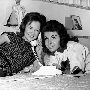 photo of Annette Funicello sharing a telephone call with a friend