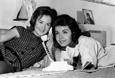 photo of Annette Funicello sharing a telephone call with a friend
