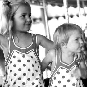 photo of two of Walt Disney's young daughters enjoying Griffith Park carousel