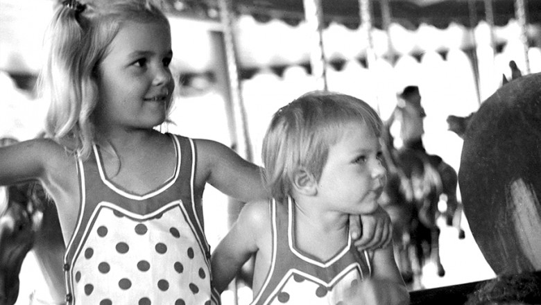 photo of two of Walt Disney's young daughters enjoying Griffith Park carousel