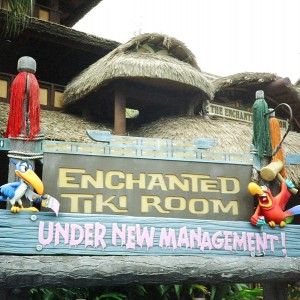 photo of sign outside the enchanted tiki room stating under new management