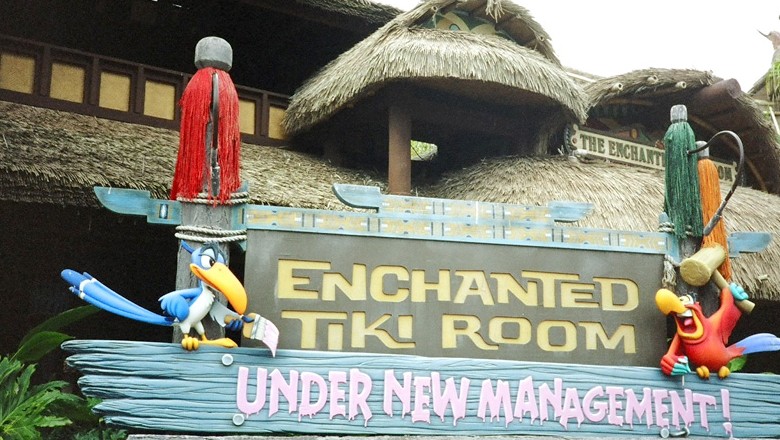 photo of sign outside the enchanted tiki room stating under new management
