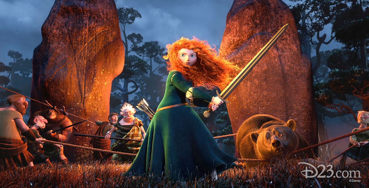 still from animated feature Brave showing Merida wielding a sword before a campfire surrounded by friends and a large bear