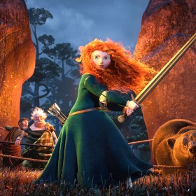 still from animated feature Brave showing Merida wielding a sword before a campfire surrounded by friends and a large bear