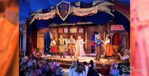 photo of stage production with ensemble medieval characters at Fantasy Faire at Disneyland