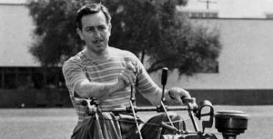 Walt Disney on a lawn mower