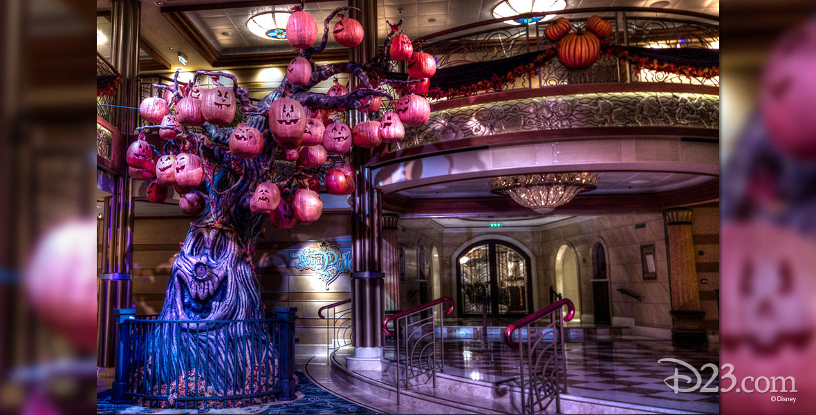 photo of gnarled tree sprouting many purple pumpkin jack-o-lanterns