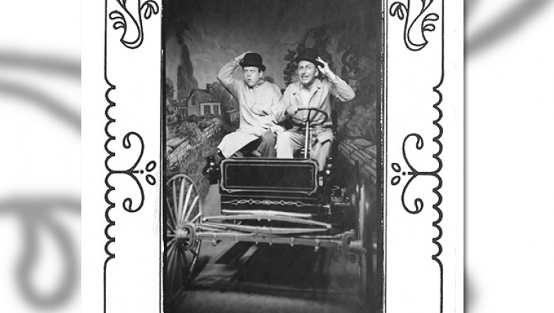 staged portrait of Walt Disney and Ward Kimball posing in a mocked-up old time jalopy during their visit to the1948 Chicago's Museum of Science and Industry