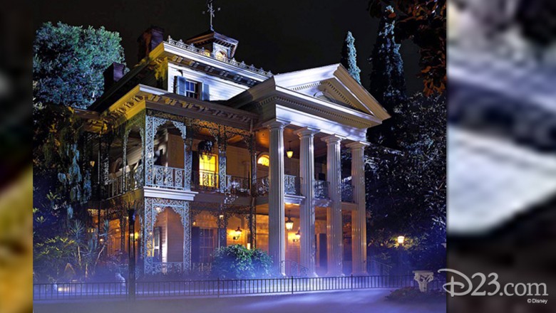 night photo of Haunted Mansion at Disneyland with purple fog