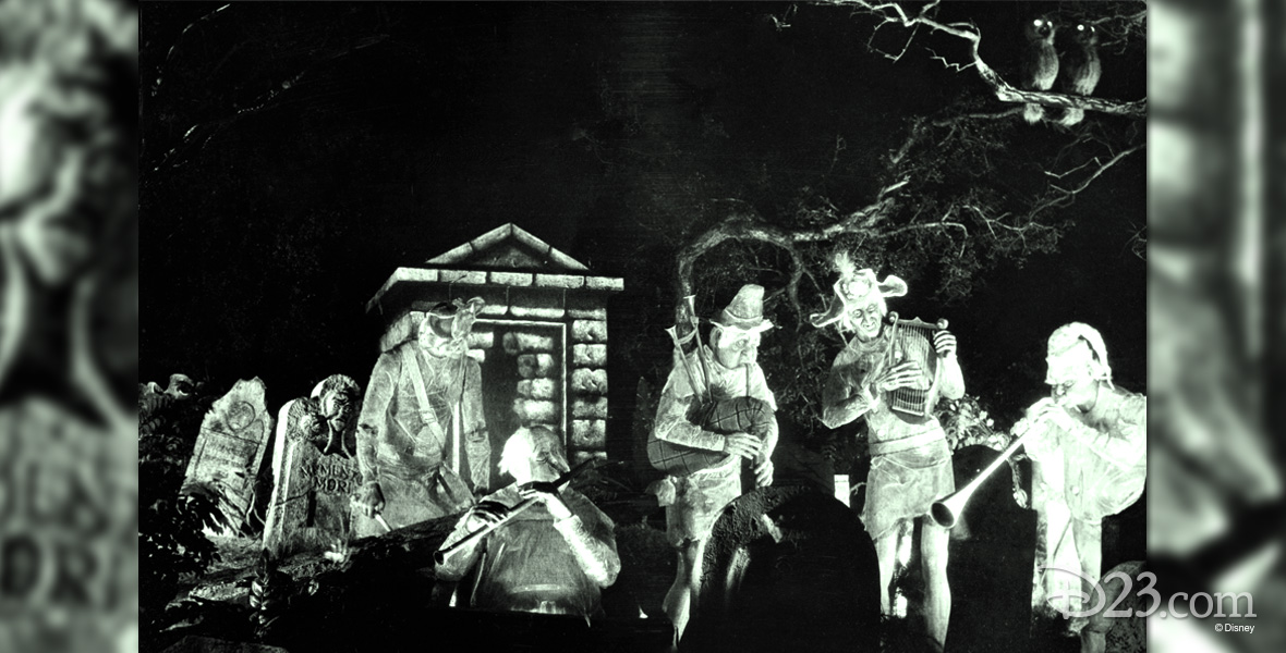 black and white photo of ghost players amidst tombstones from Disneyland's The Haunted Mansion