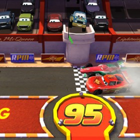video capture frame of Disney Interactive game Cars Fast as Lightning showing cars at starting line while other cars occupy raceway stands