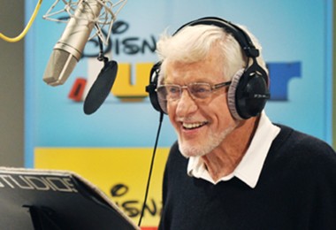 photo of Dick Van Dyke in recording booth wearing headphones