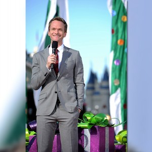 photo of Neil Patrick Harris in suit holding microphone