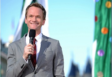 photo of Neil Patrick Harris in suit holding microphone