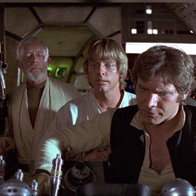 movie still from Star Wars Episode 4 showing Chewbacca, Obi-Wan Kenobi, Luke Skywalker, Han Solo, Millenium Falcon