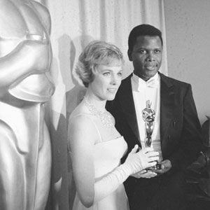 Julie Andrews (seen here with presenter Sidney Poitier) moments after having received a Best Actress Oscar for her film debut in Walt Disney's Mary Poppins.