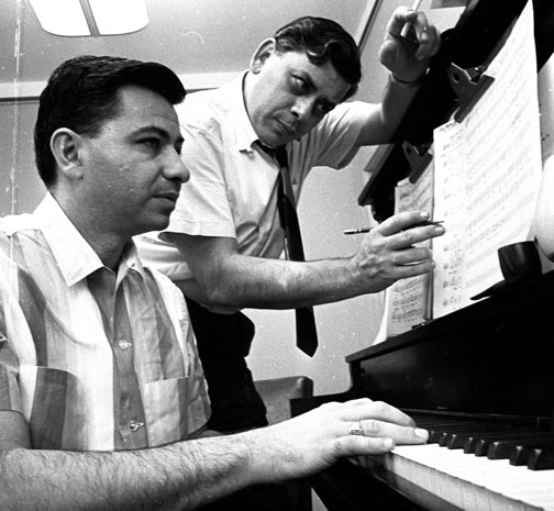 Robert and Richard Sherman composing music at a piano