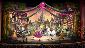 illustrated stage scene from the animated feature Tangled showing Rapunzel dancing center stage with a white horse