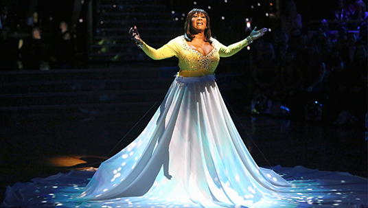 photo of Patti LaBelle in long flowing gown singing on stage