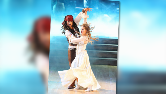 photo of Riker Lynch and Allison Holker dancing together dressed as pirate and maiden