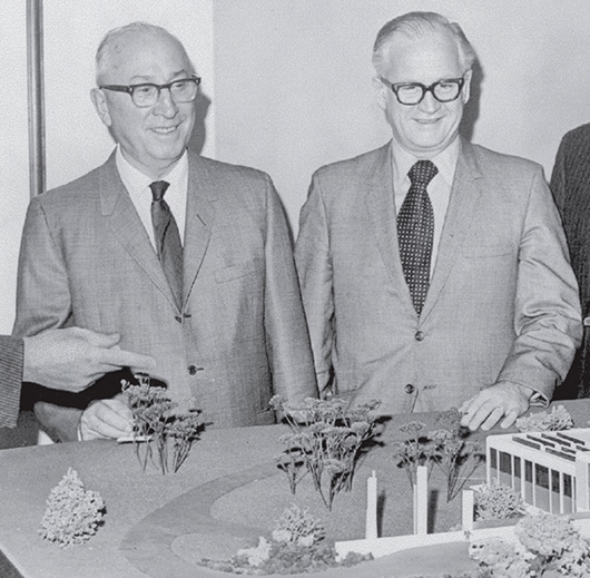 Roy O. Disney with Harrison "Buzz" Price looking at a scale model of what would become CalArts.