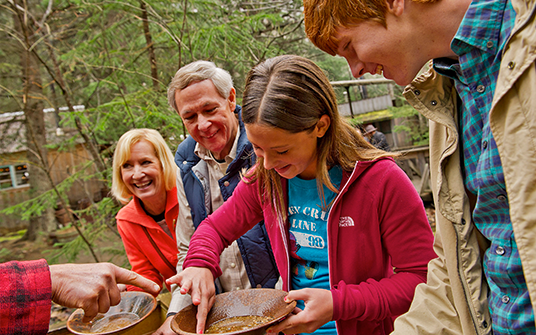 photo of family panning for gold