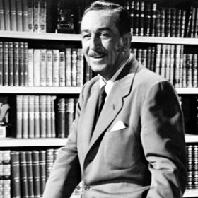 photo of Walt Disney seated in library