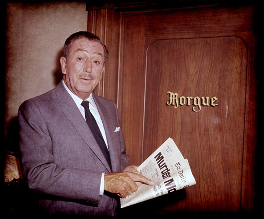 Walt Disney standing in front the city morgue