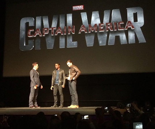 photo of Robert Downey Jr., Chris Evans, and Black Panther star Chadwick Boseman on stage at the El Capitan Theatre